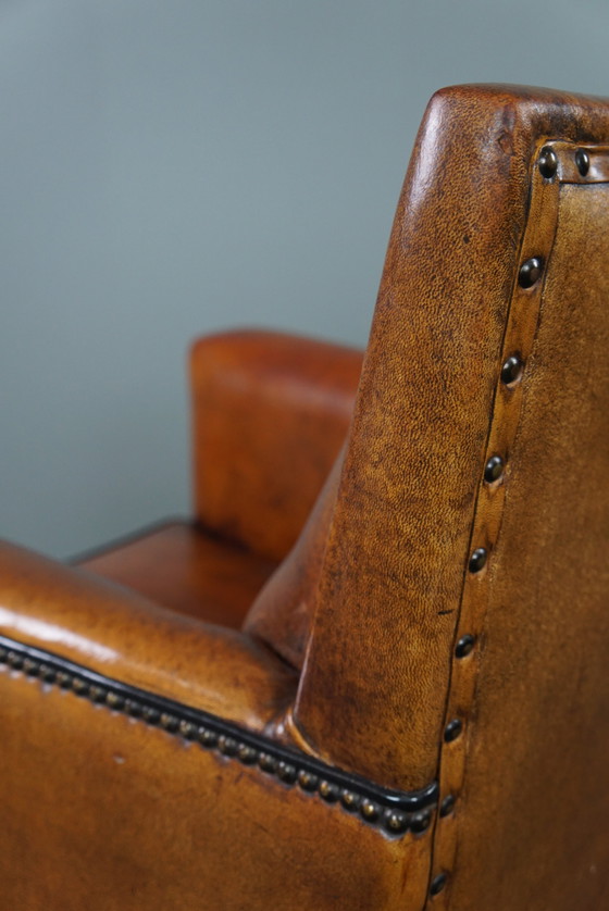 Image 1 of Art Deco armchair with black piping and decorative nails