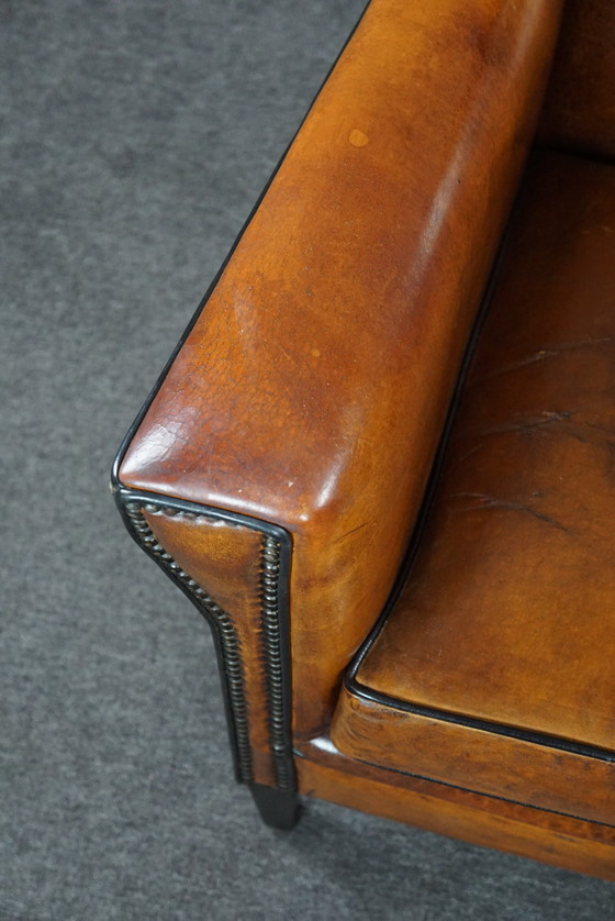 Image 1 of Art Deco armchair with black piping and decorative nails