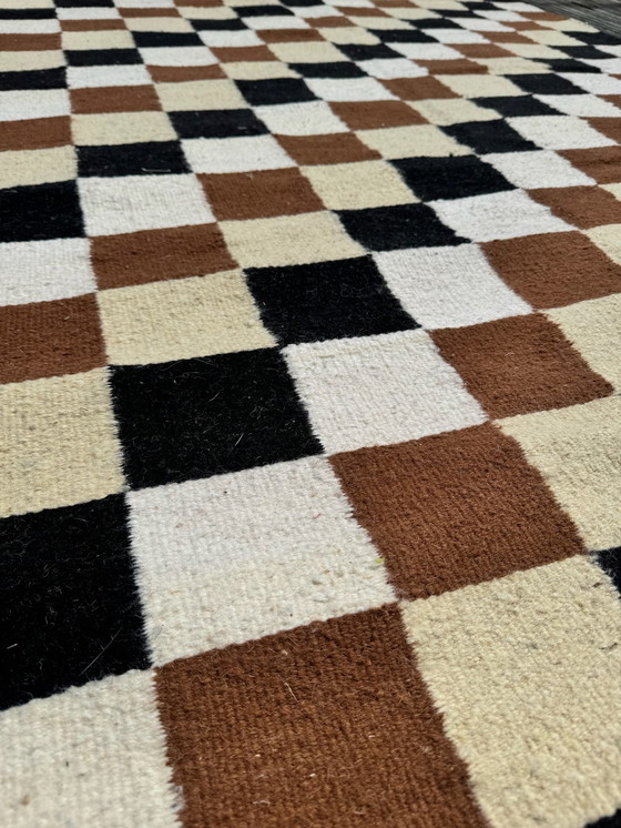 Image 1 of Checkered rug