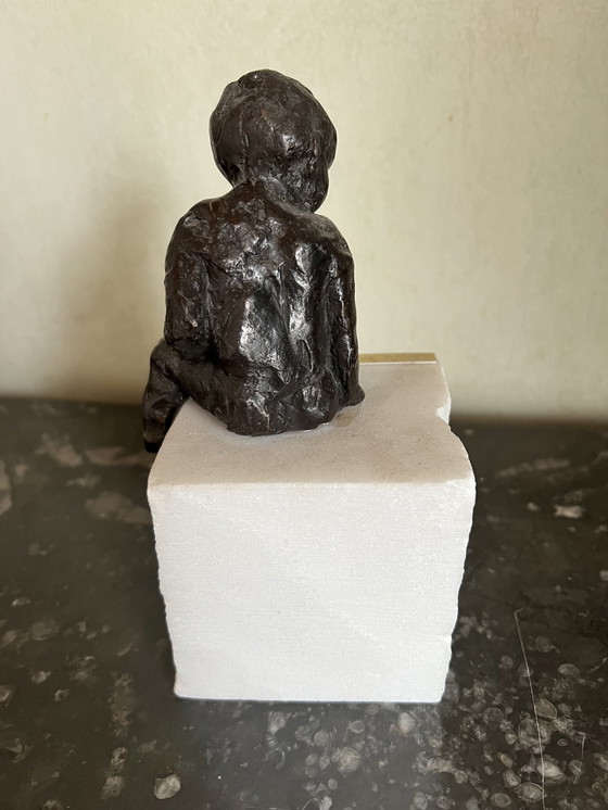 Image 1 of Yvi De Backer seated child