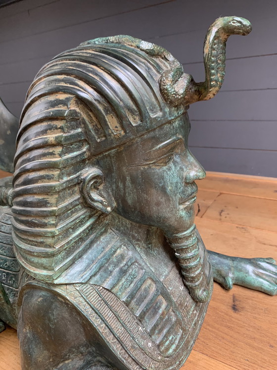 Image 1 of 2 statues/sphinx en bronze avec des ailes