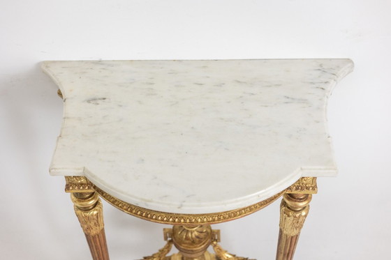 Image 1 of Carved and gilded wood console with marble top. Circa 1880.