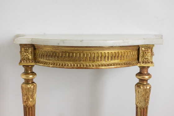 Image 1 of Carved and gilded wood console with marble top. Circa 1880.