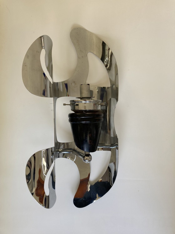 Image 1 of A pair of wall lights in glass & metal