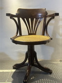 Vintage captain's chair with webbing seat and swivel base