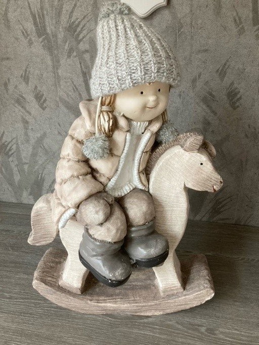 Stone Girl On Rocking Horse