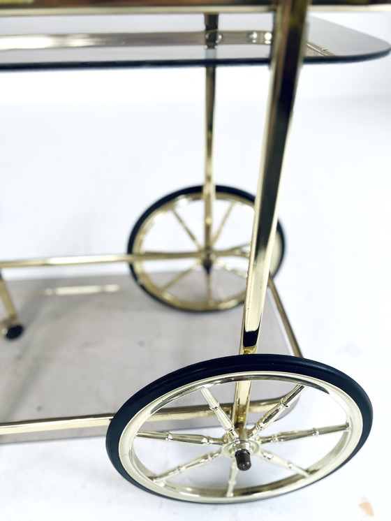 Image 1 of Smoked glass & brass coated bar cart