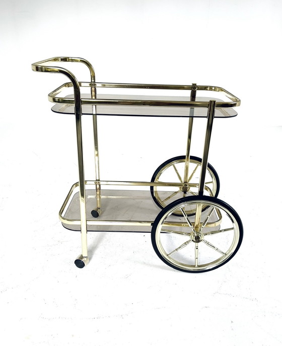 Image 1 of Smoked glass & brass coated bar cart