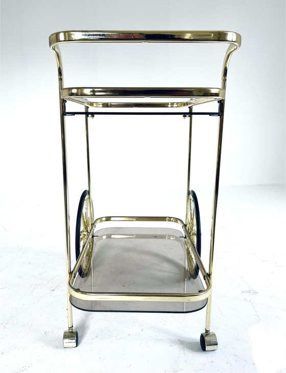 Image 1 of Smoked glass & brass coated bar cart