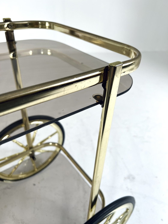 Image 1 of Smoked glass & brass coated bar cart