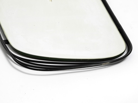 Image 1 of Mid Century Modern wall mirror with a black abstract metal frame