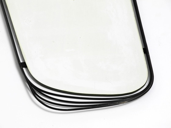 Image 1 of Mid Century Modern wall mirror with a black abstract metal frame