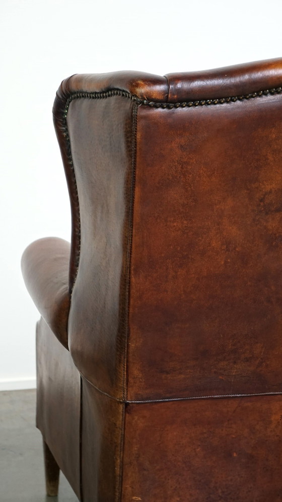 Image 1 of Grand fauteuil à oreilles en cuir de mouton