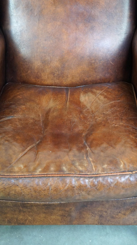 Image 1 of Grand fauteuil à oreilles en cuir de mouton