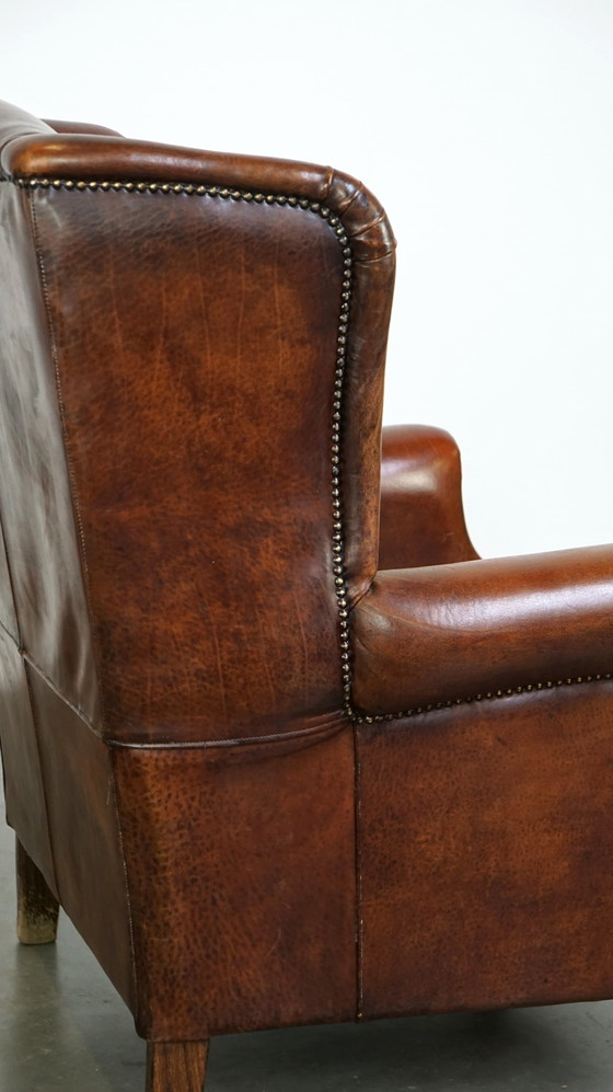 Image 1 of Grand fauteuil à oreilles en cuir de mouton