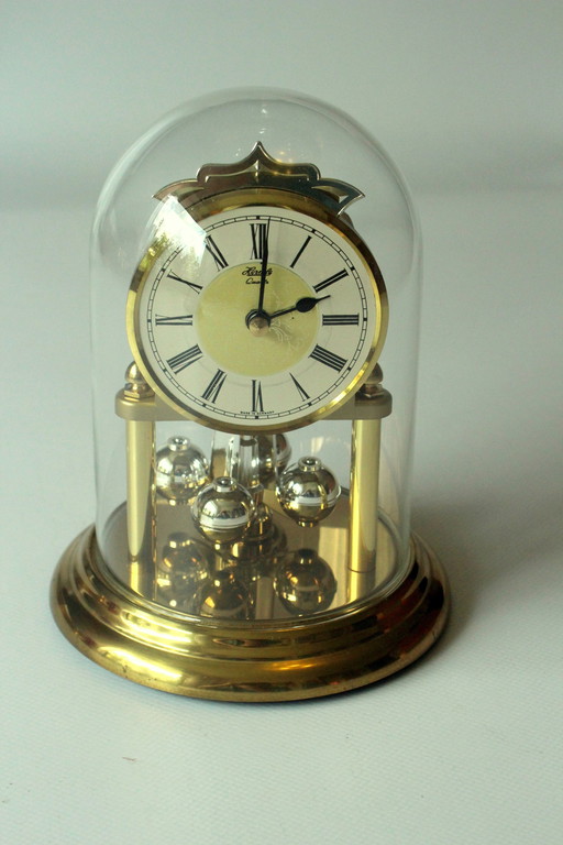 Elegant pendulum clock Hermle brass with glass dome, table clock, vintage