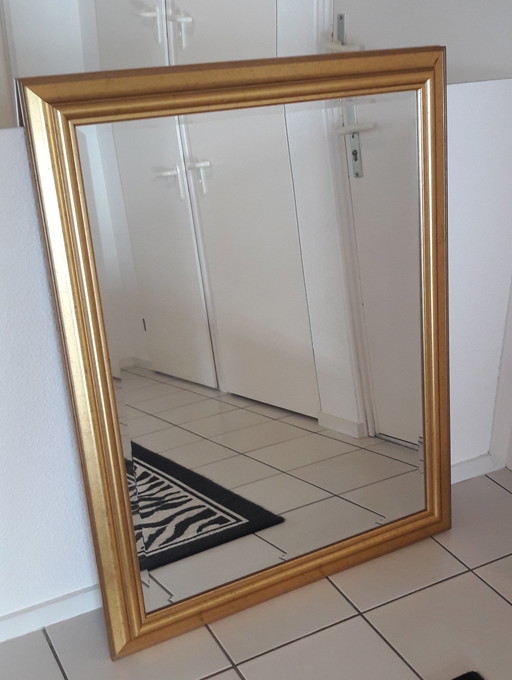 Miroir vintage peint en or