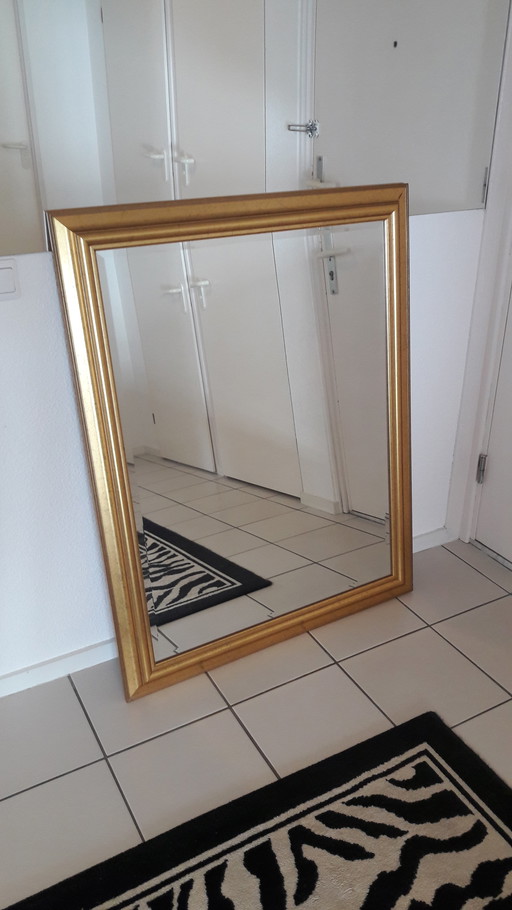 Miroir vintage peint en or