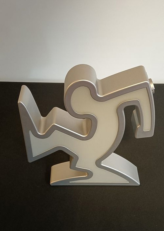 Image 1 of Keith Haring La Linea Lamp Osvaldo Cavandoli argenté dans son emballage d'origine