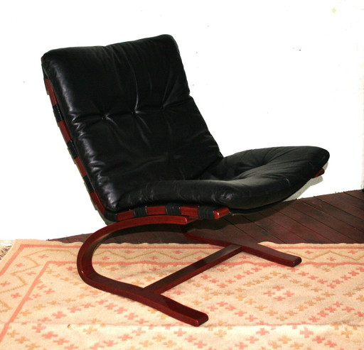 Midcentury Scandinavian cantilever armchair with leather cushion