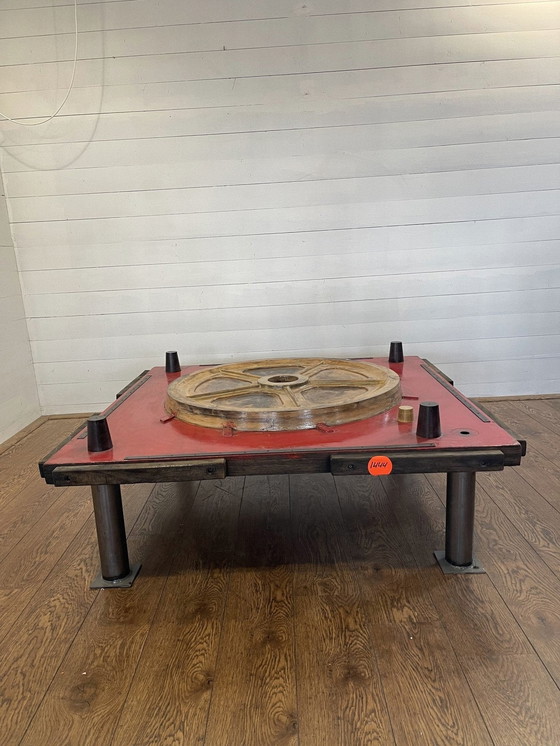 Image 1 of Unique industrial table made from a wooden mold with negative train wheel