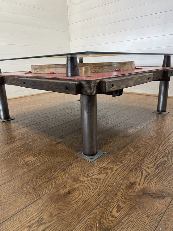 Image 1 of Unique industrial table made from a wooden mold with negative train wheel