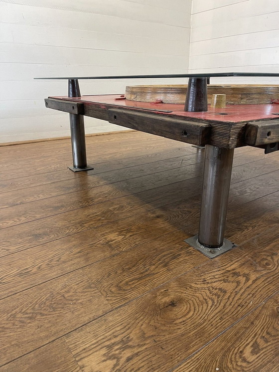 Image 1 of Unique industrial table made from a wooden mold with negative train wheel