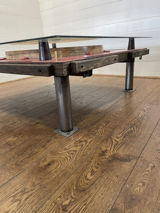 Image 1 of Unique industrial table made from a wooden mold with negative train wheel