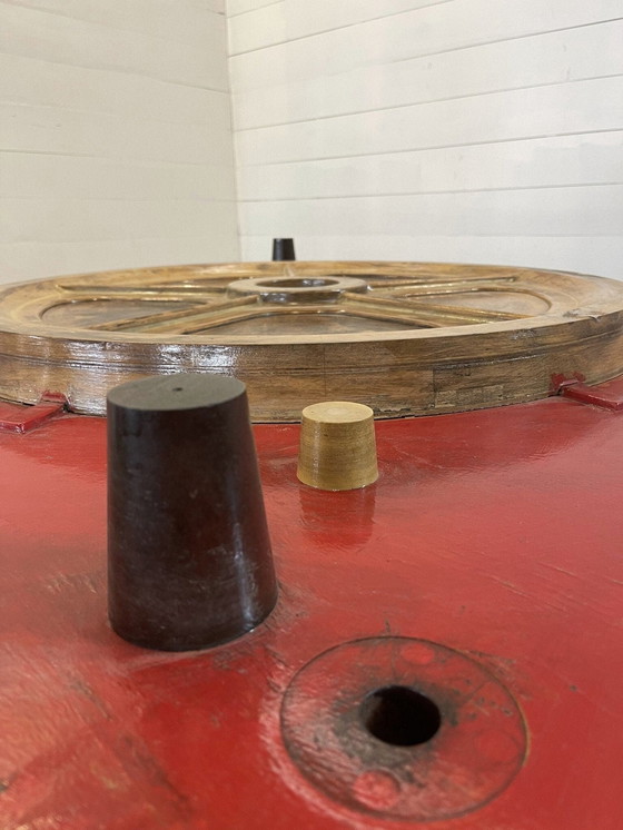 Image 1 of Unique industrial table made from a wooden mold with negative train wheel