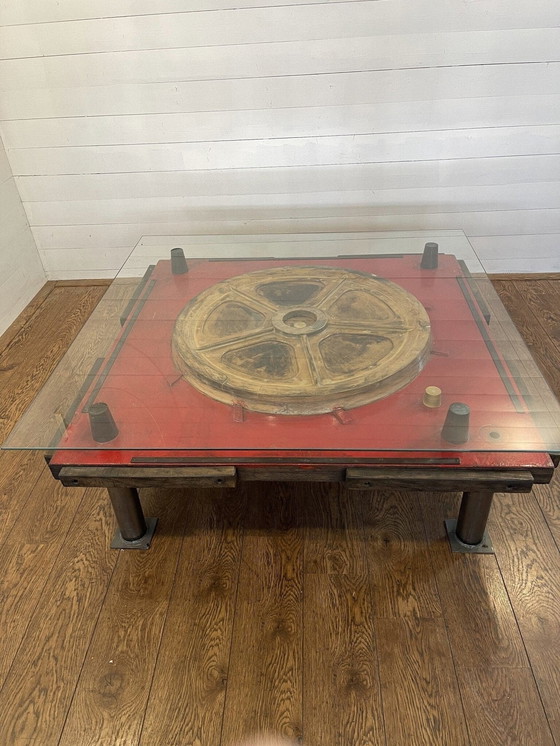 Image 1 of Unique industrial table made from a wooden mold with negative train wheel