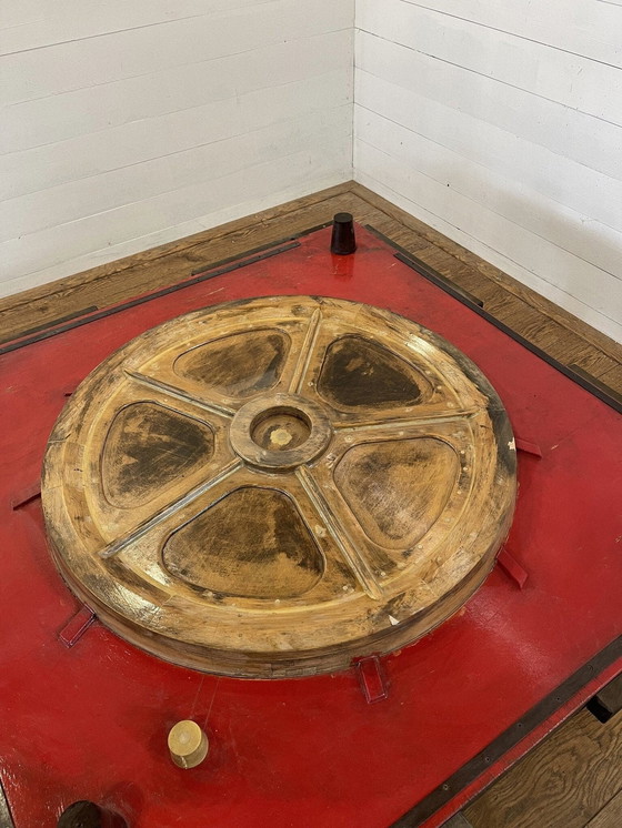 Image 1 of Unique industrial table made from a wooden mold with negative train wheel