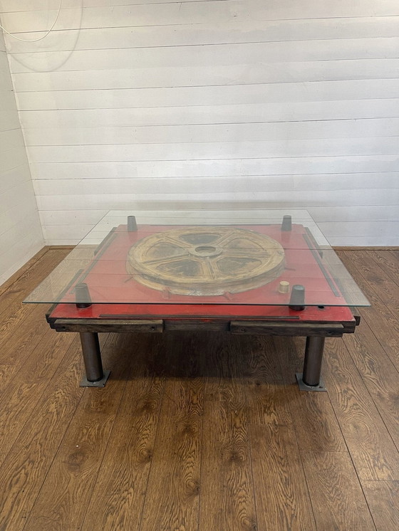 Image 1 of Unique industrial table made from a wooden mold with negative train wheel