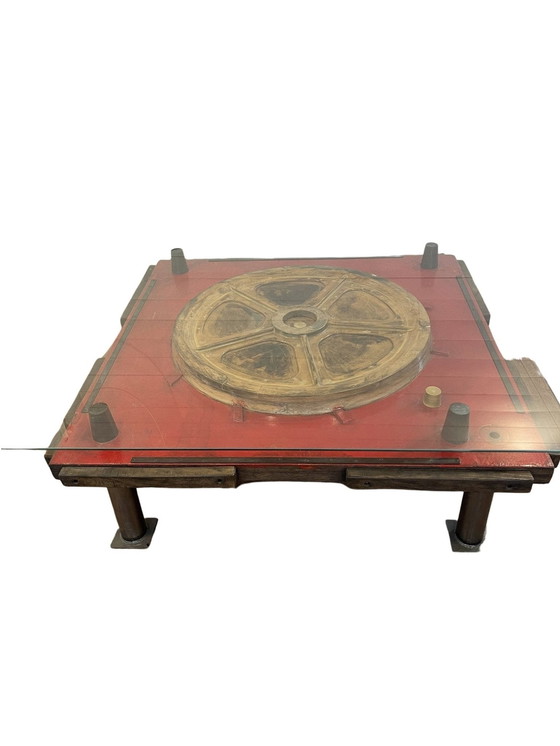 Image 1 of Unique industrial table made from a wooden mold with negative train wheel