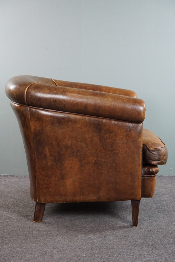 Image 1 of Club chair with patina, made of sheep leather