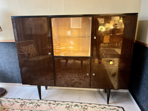 Highboard or bar cabinet of the German Mid Century'S made of walnut/macassar veneer with glossy surface, 1960s