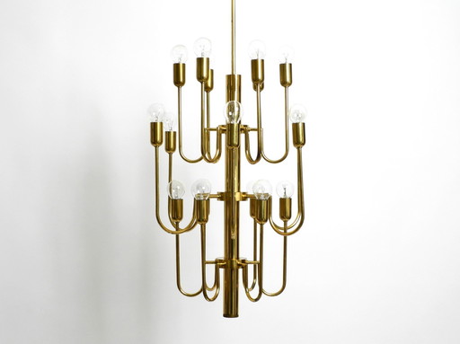 Beautiful Three Staged 18 Arm Mid Century Brass Chandelier With A Long Brass Rod