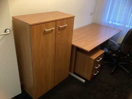 One Desk, One Drawer Block And One File Cabinet.