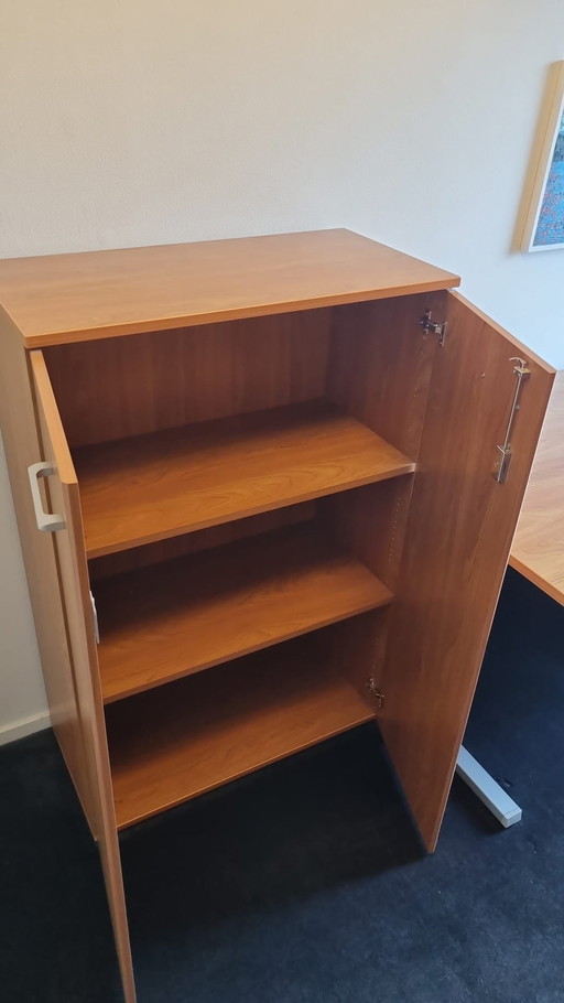 One Desk, One Drawer Block And One File Cabinet.