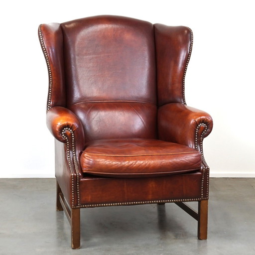 Grand fauteuil à oreilles en cuir de mouton