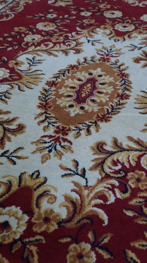 Image 1 of Red Oriental wool rug with yellow flowers, 285 x 200 cm