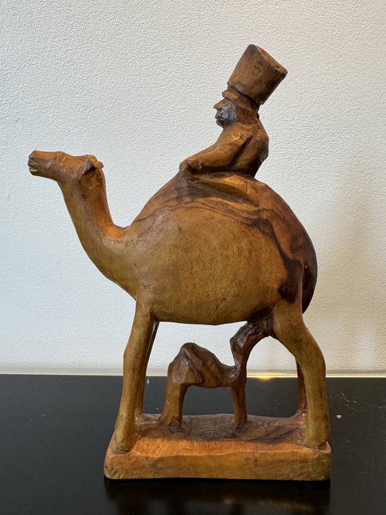 Image 1 of Wooden sculpture man on camel