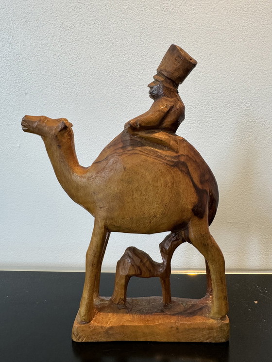 Image 1 of Wooden sculpture man on camel