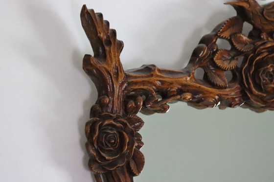 Image 1 of Miroir chinois en forme de fleurs et de branches sculptées