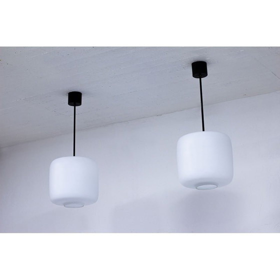 Image 1 of Pair of vintage Swedish black metal and white matte opaline glass pendant lamps, 1950s