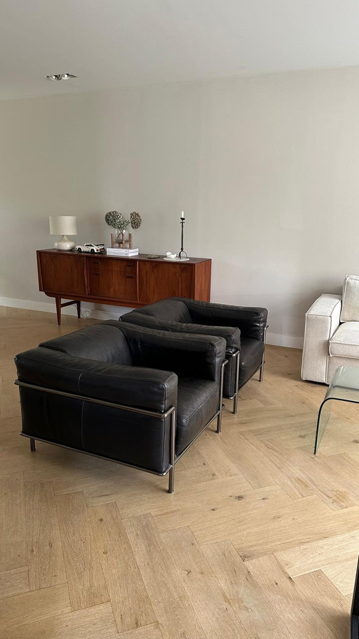 2x Natuzzi leather armchairs