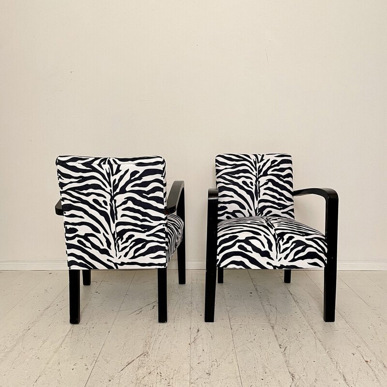Pair of vintage Art Deco armchairs in black wood and zebra fabric