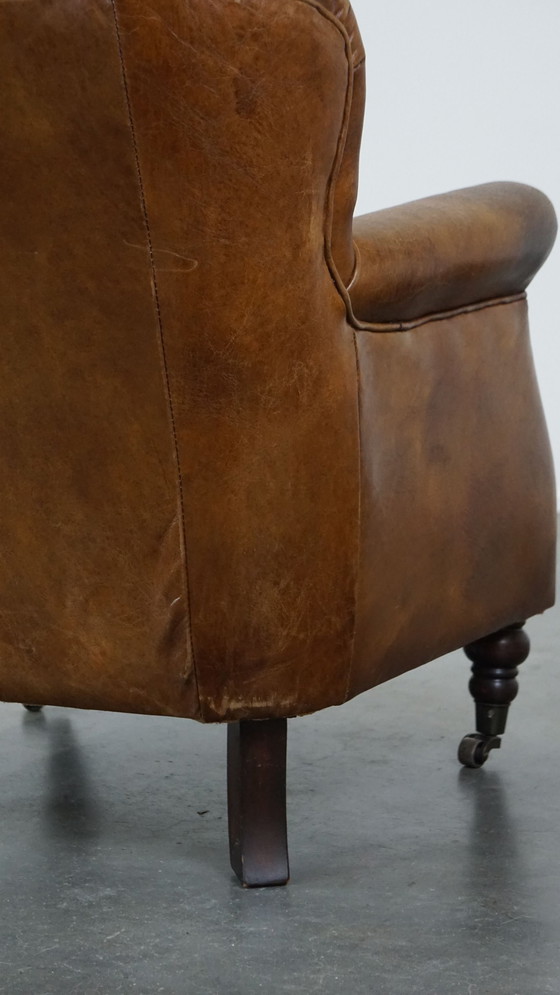 Image 1 of Beef Leather Armchair With Front Legs On Wheels