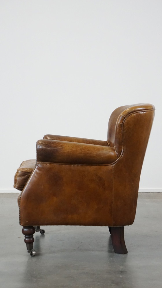 Image 1 of Beef Leather Armchair With Front Legs On Wheels