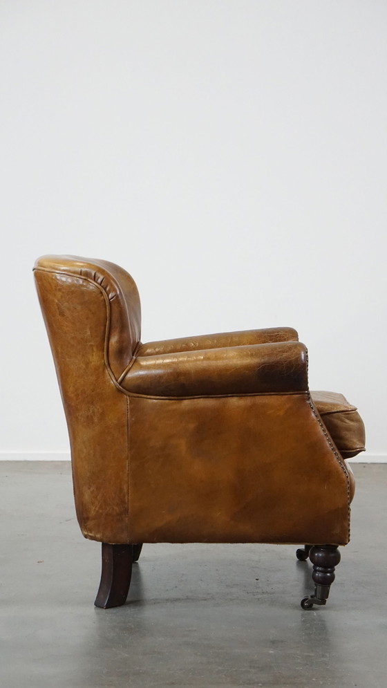 Image 1 of Beef Leather Armchair With Front Legs On Wheels