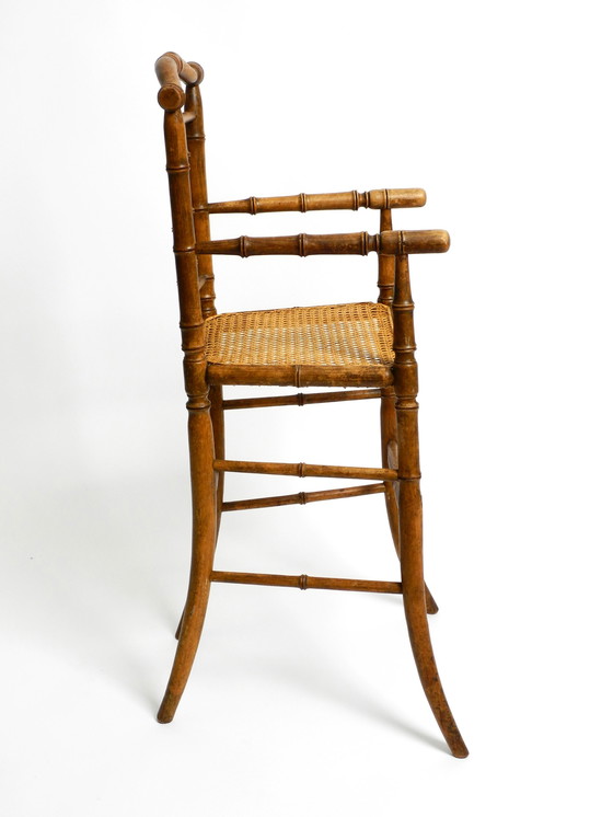 Image 1 of French highchair for a child from the 1930s made of bentwood with Viennese wicker seat